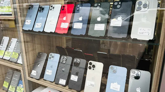 Row of smartphones prepared for inspection at PayMore Rockville