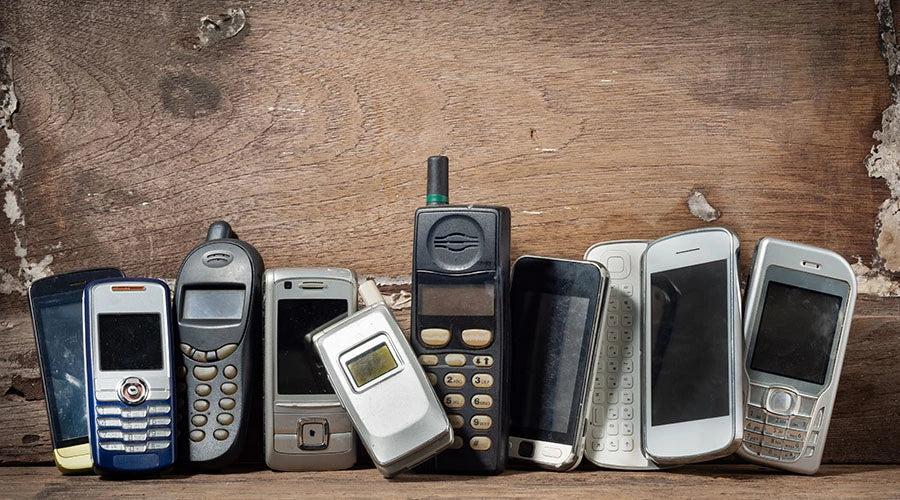 Collection of used smartphones ready for reuse and reselling at PayMore Rockville